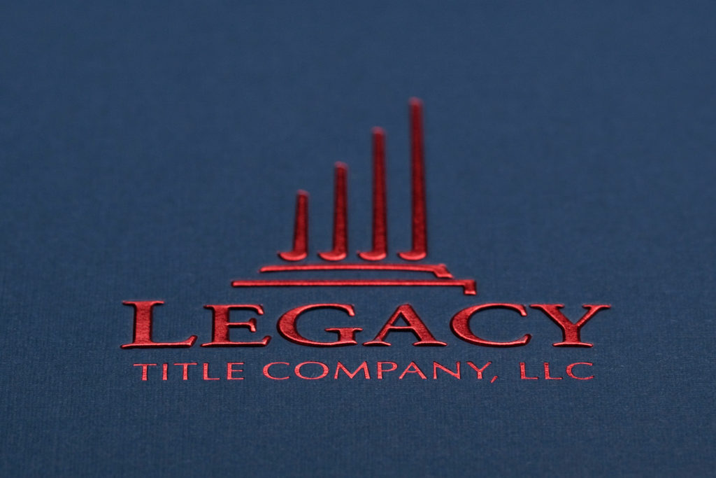 blue pocket folder with red foil stamping