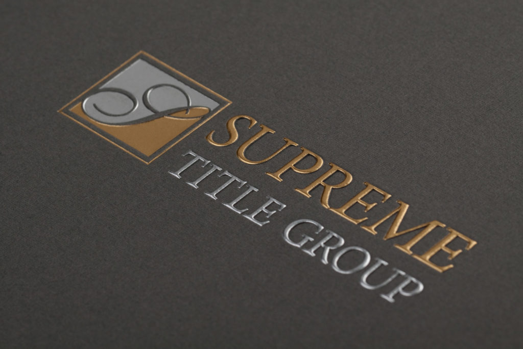 gray pocket folder with silver and gold foil